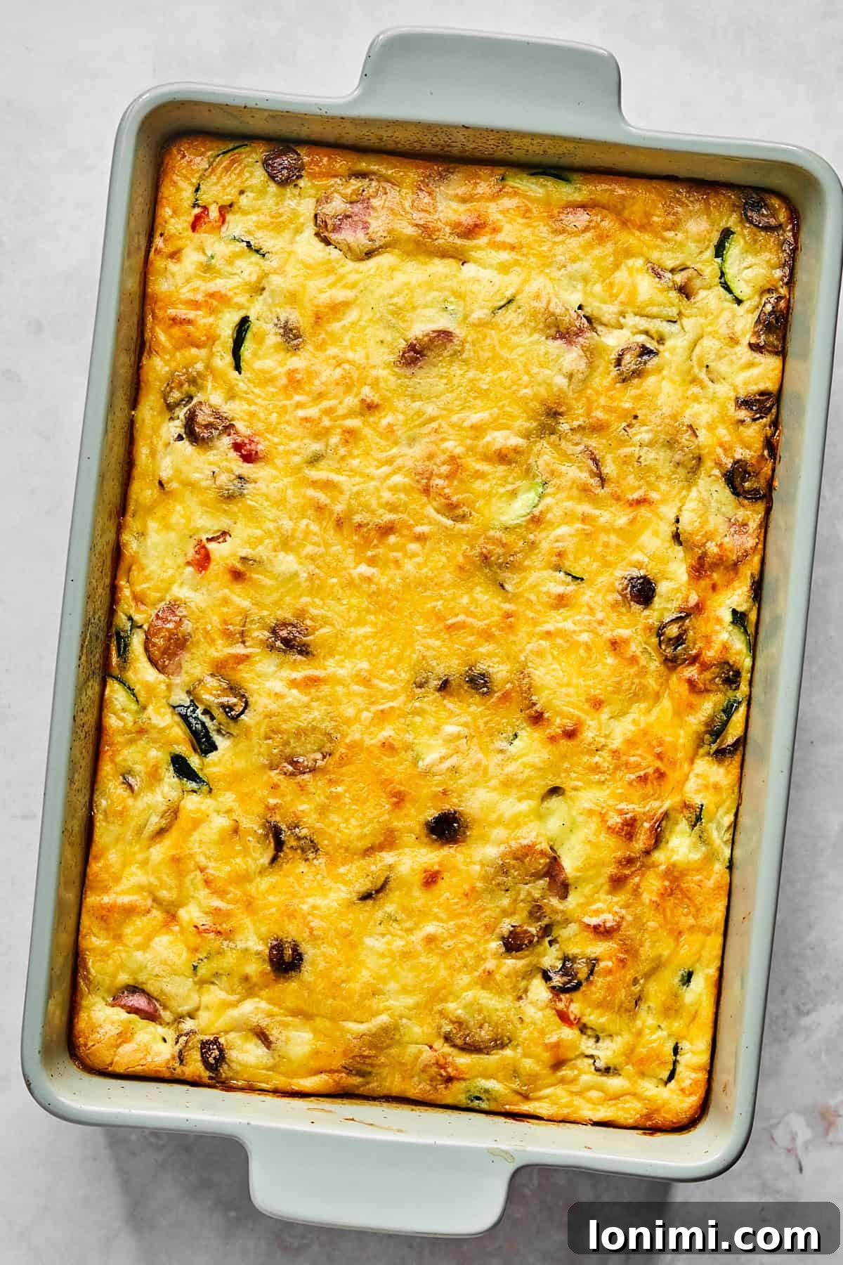 Fully baked cottage cheese egg casserole resting on the counter, golden and bubbly