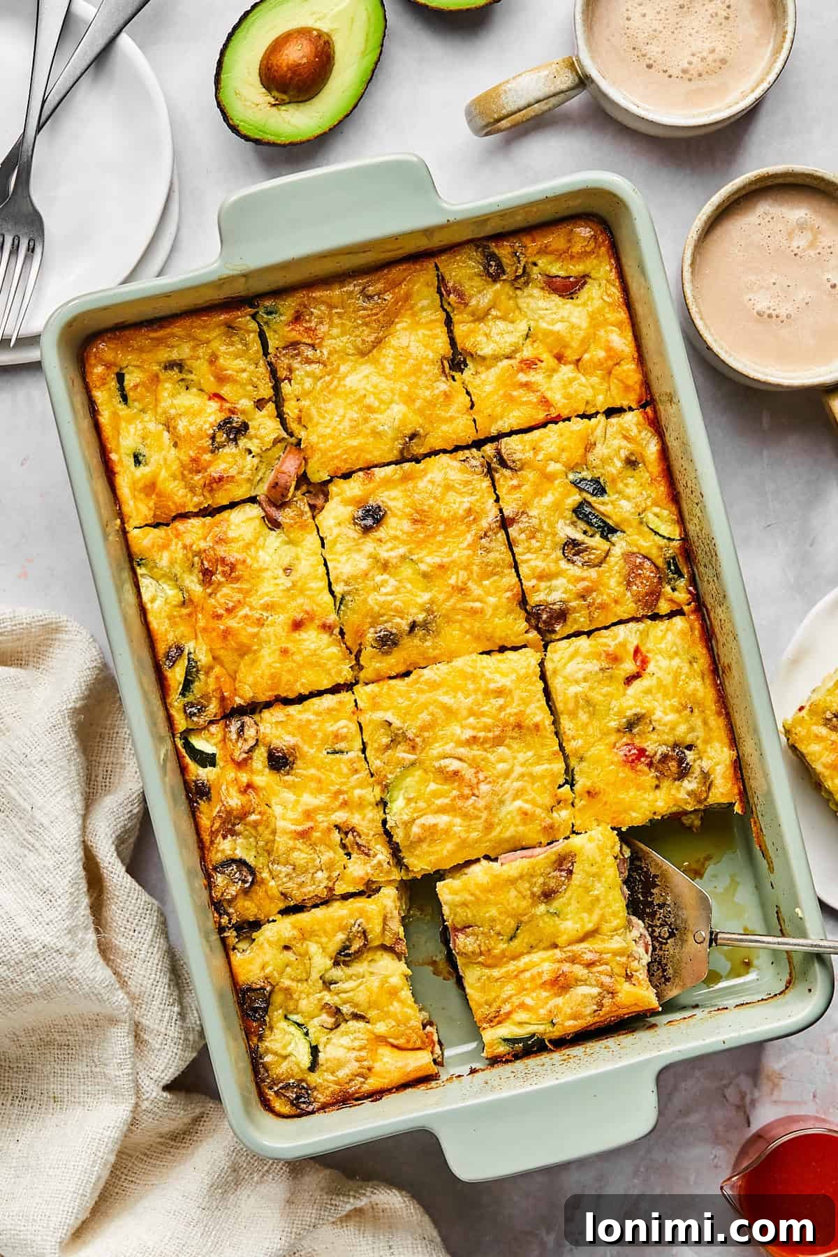 Cottage cheese egg bake in a baking dish, golden brown on top and sliced