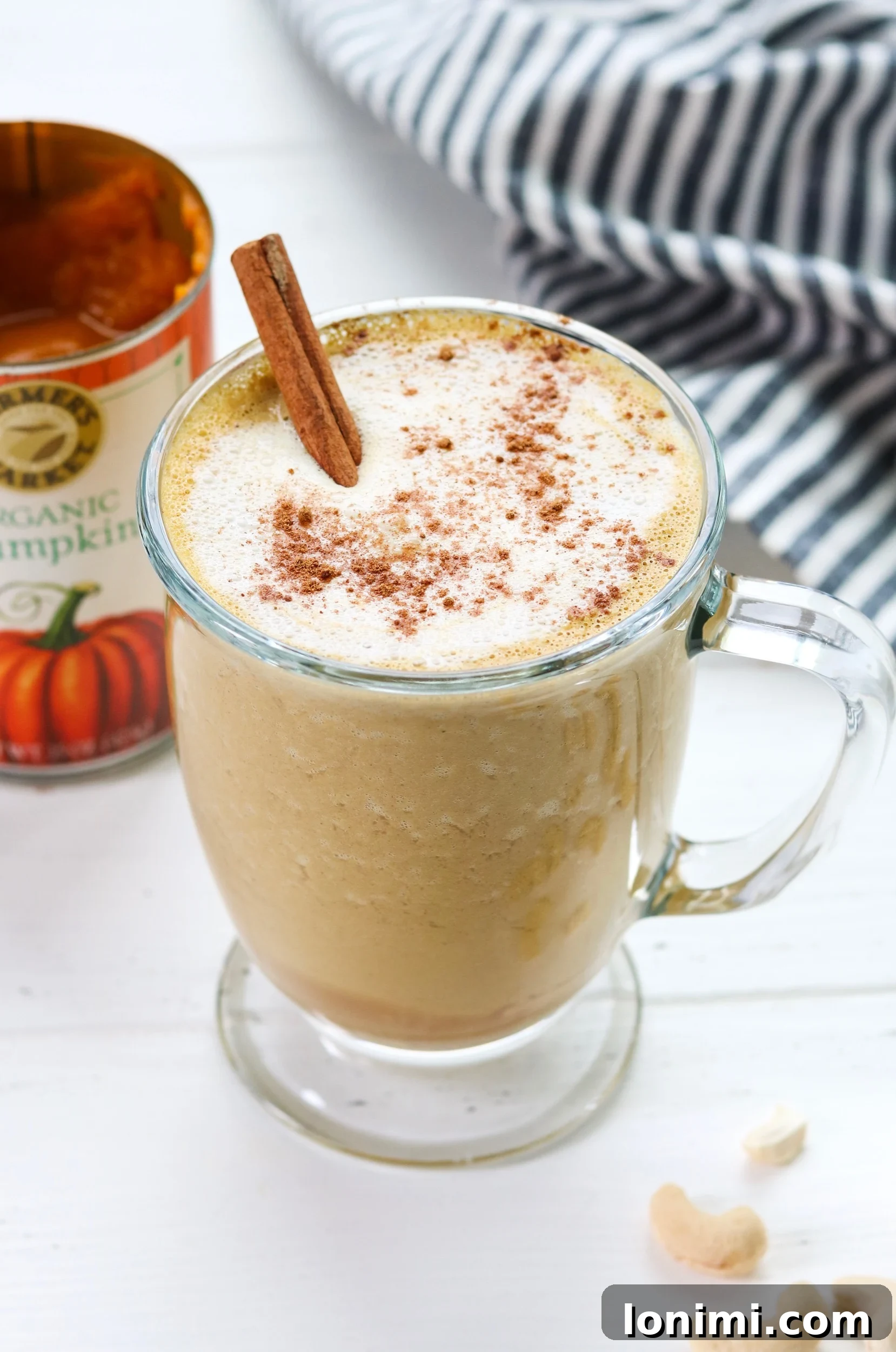 Pumpkin spice latte topped with coconut cream and spices
