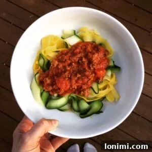 Close-up of Zucchini and Summer Squash Ribbons with savory Meat Sauce