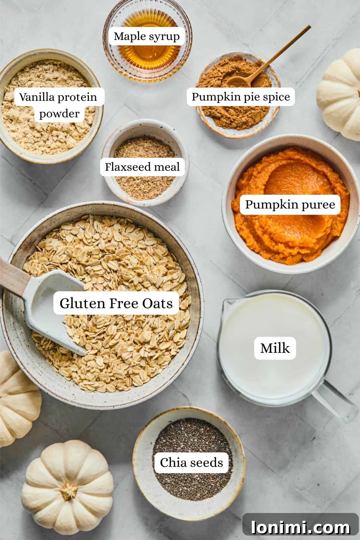 ingredients for pumpkin overnight oats in nesting bowls