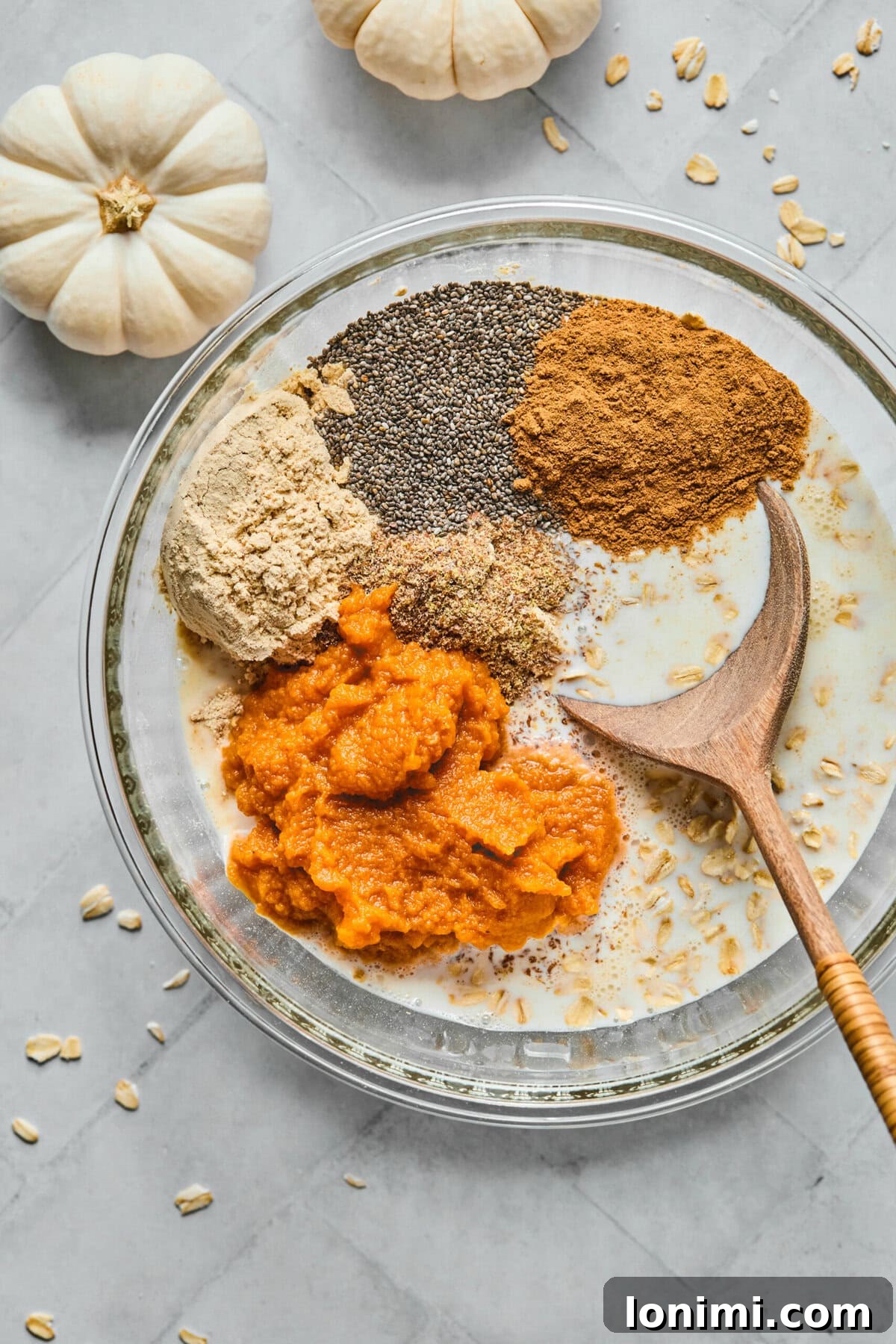 ingredients for pumpkin overnight oats in a large bowl