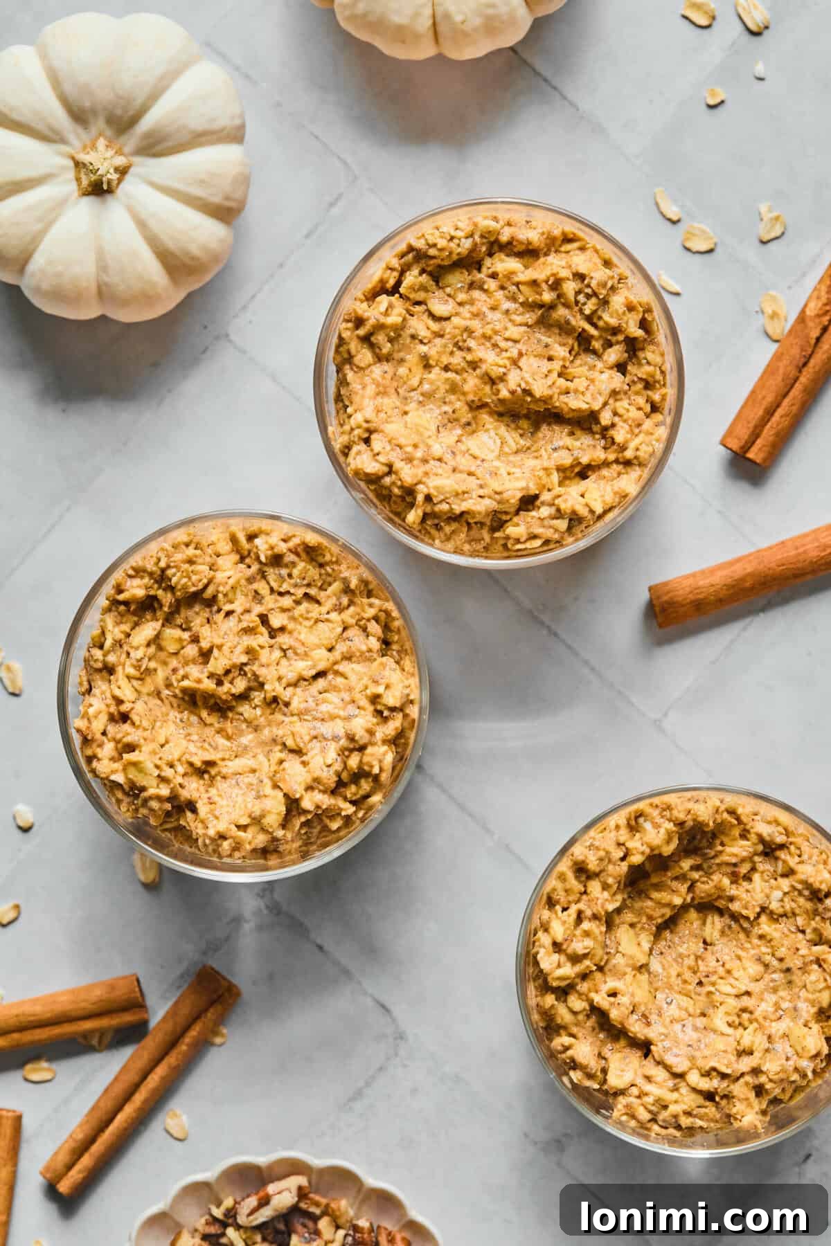 pumpkin overnight oats in 3 glass jars