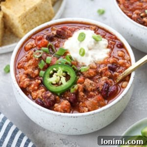 Slow cooker turkey chili with sour cream and jalapeño