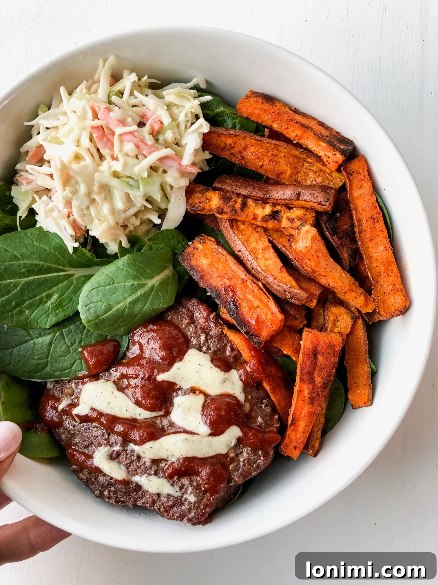 Labor Day Weekend Rewind 4 Whole30 BBQ burger bowls served with crispy sweet potato fries and creamy cilantro lime coleslaw