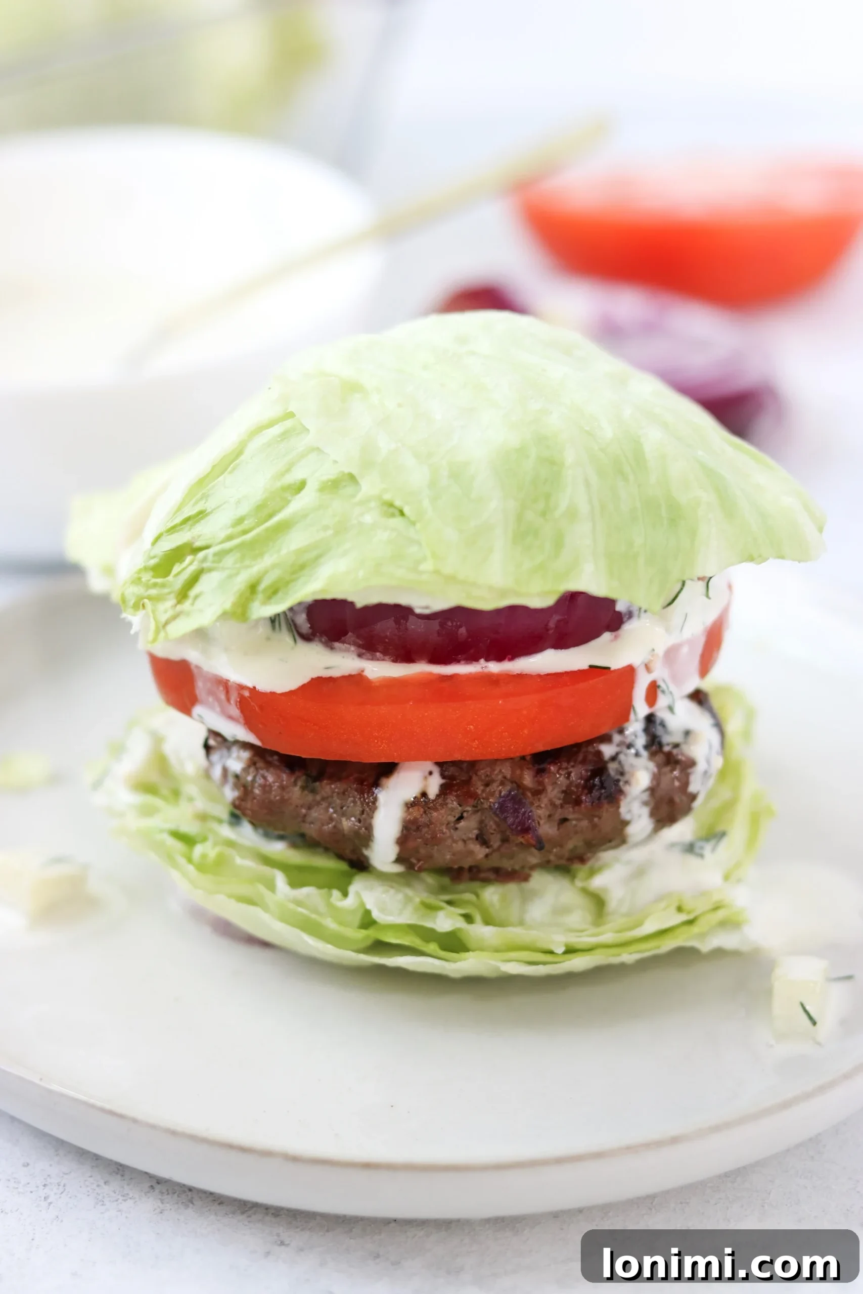 Labor Day Weekend Rewind 6 Whole30 compliant lettuce bun burgers with a creamy dairy-free tzatziki sauce