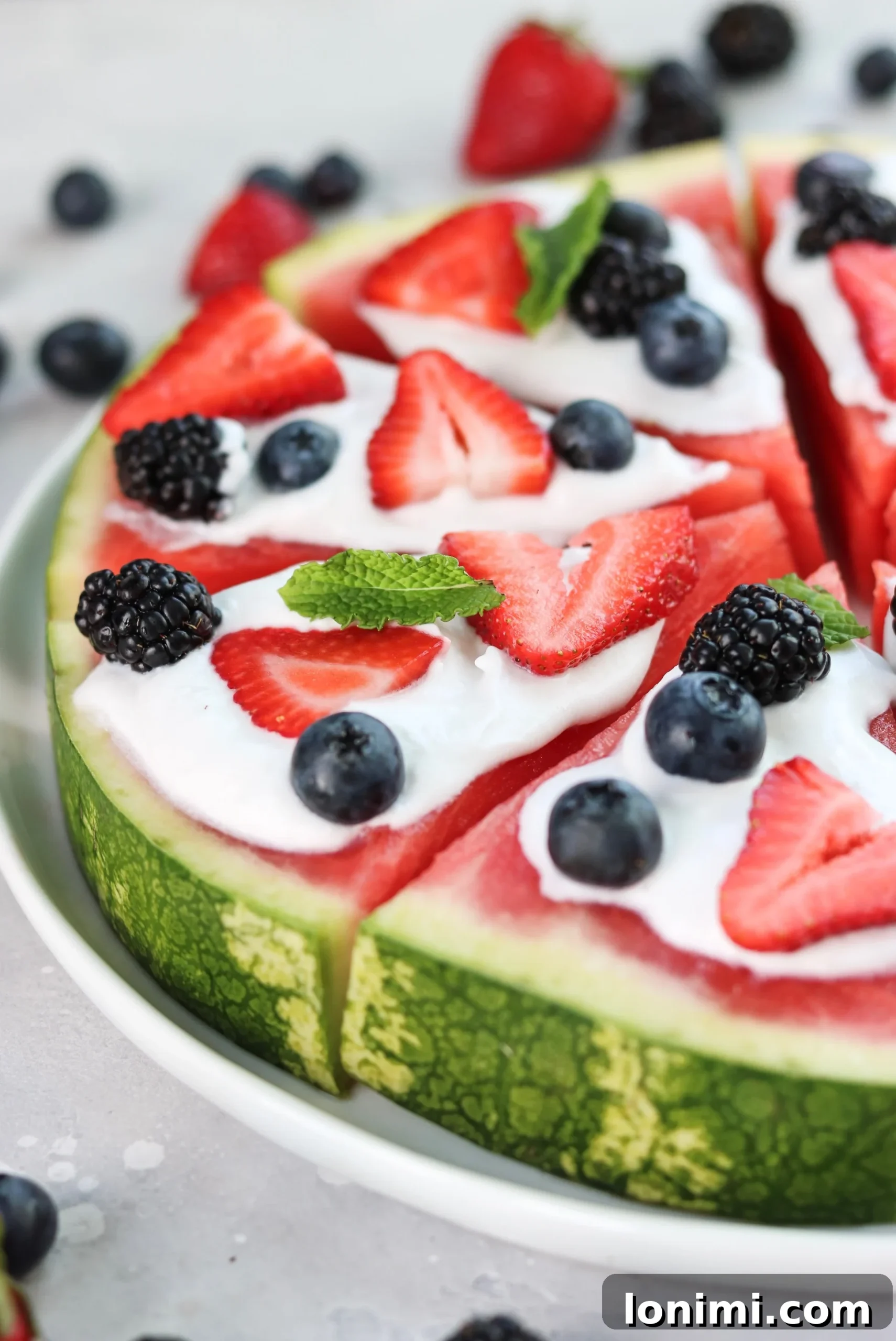 Labor Day Weekend Rewind 17 Whole30 watermelon pizza topped with coconut cream and fresh berries, a fun and healthy dessert