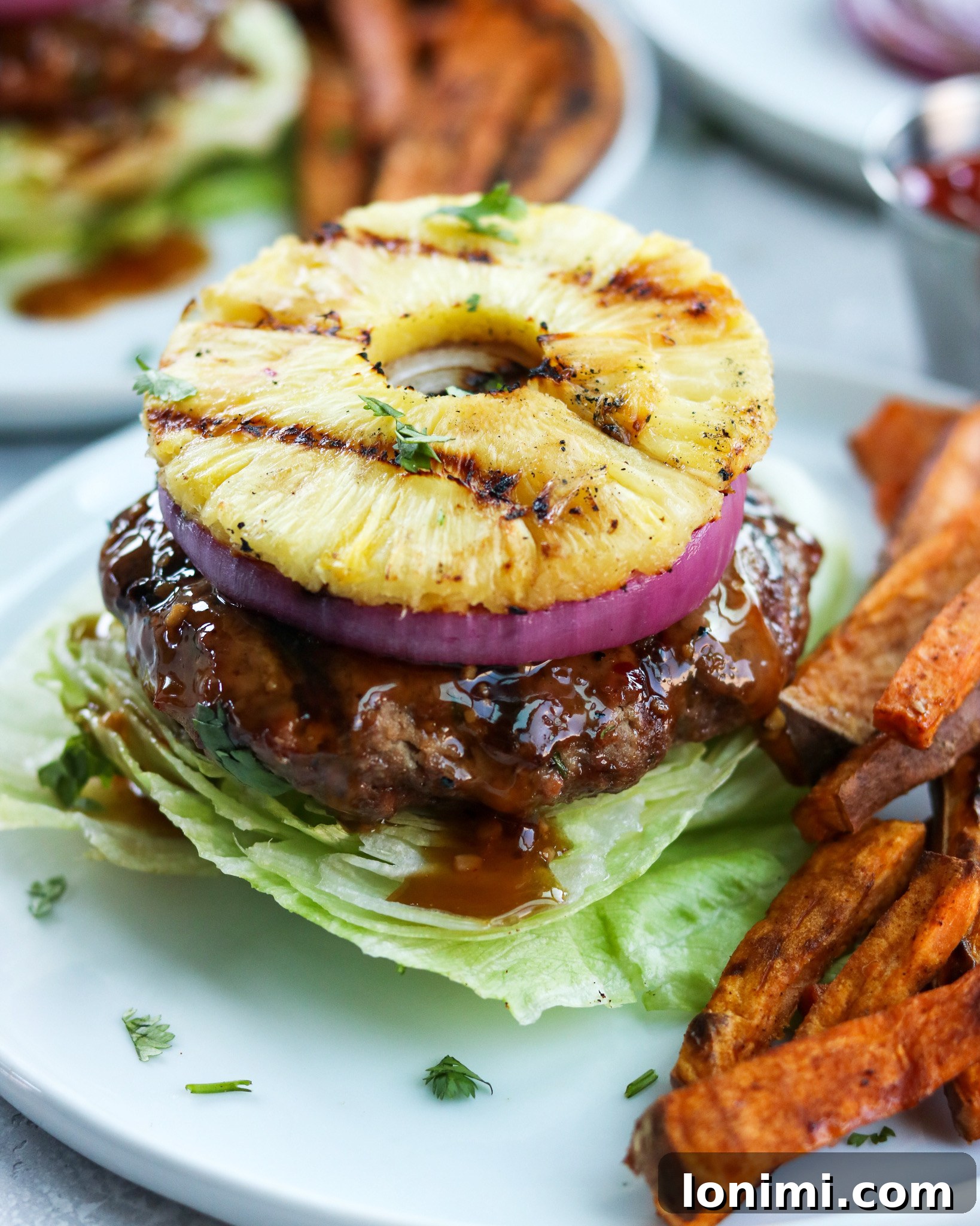 Labor Day Weekend Rewind 3 Whole30 compliant teriyaki burgers topped with sweet grilled pineapple slices