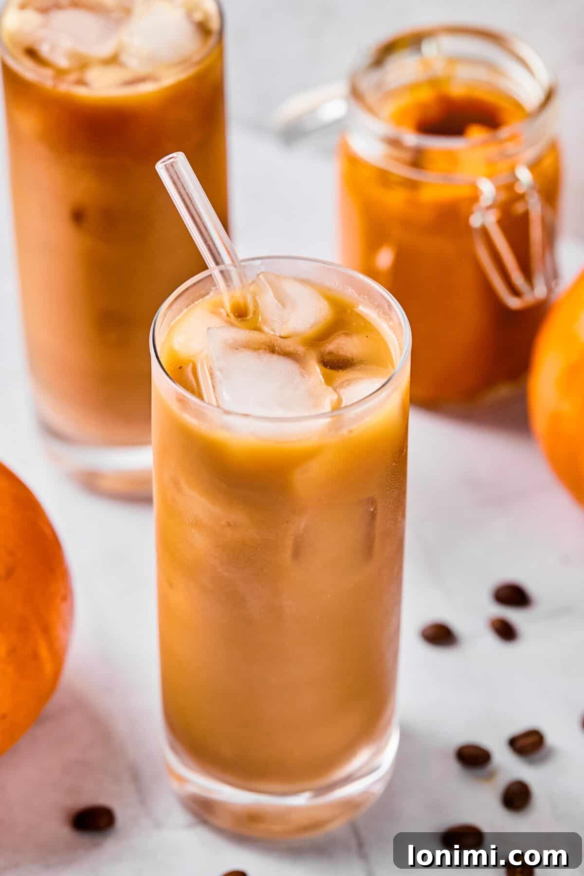 Homemade Protein Pumpkin Cold Foam Perfection 9 A delicious glass of protein pumpkin cold brew, featuring a generous layer of creamy cold foam on top, perfectly capturing the essence of fall.