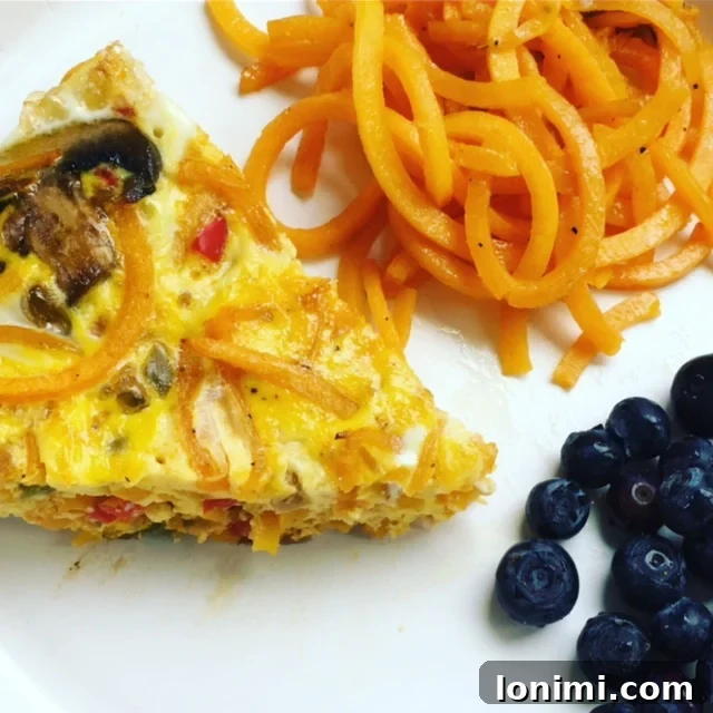 Close-up of a slice of Butternut Squash Noodle Frittata, highlighting the texture and ingredients.