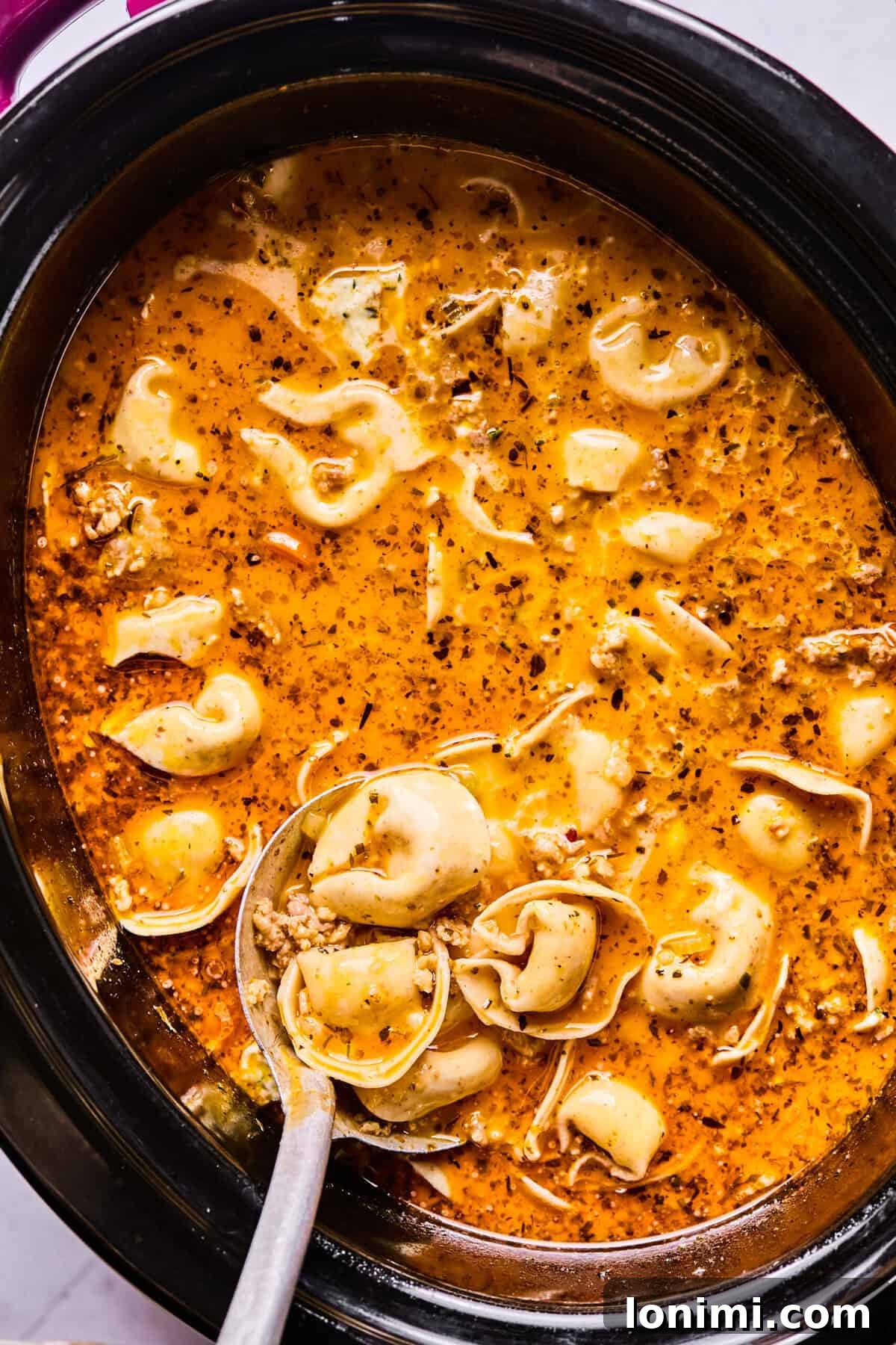 Slow Cooker Creamy Sausage Tortellini Soup 9 cooked tortellini resting inside the slow cooker