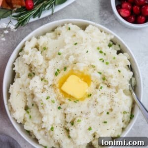 Whole30 mashed potatoes with vegan butter and chives in a white bowl