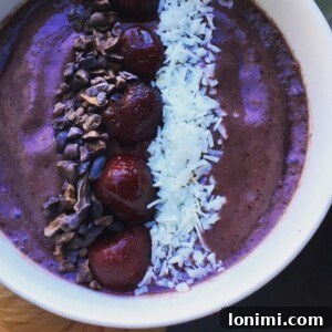 Close-up of a vibrant Chocolate Cherry Milkshake Smoothie in a glass, ready to be enjoyed.