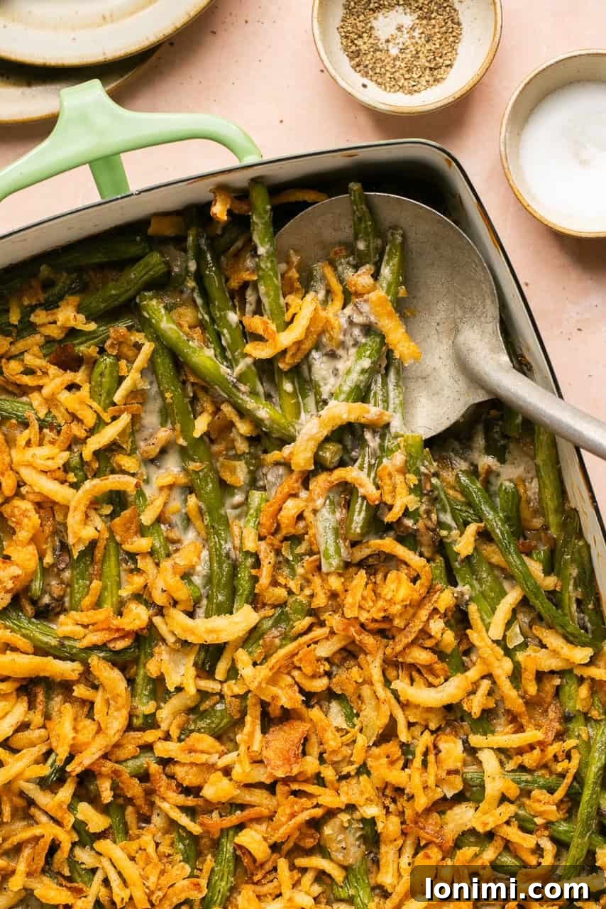 a close up of fried onions mixed with green beans