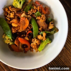 Wok-Kissed Turkey & Veggie Delight 3 Close-up of a vibrant Chinese Turkey Stir-Fry, showcasing lean ground turkey and colorful vegetables coated in a savory sauce.