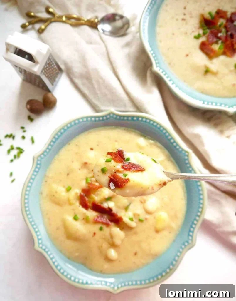 25 Hearty Whole30 Soups, Stews, and Chilis 12 Creamy Paleo Whole30 Potato Soup, a comforting and dairy-free option, garnished with chives.