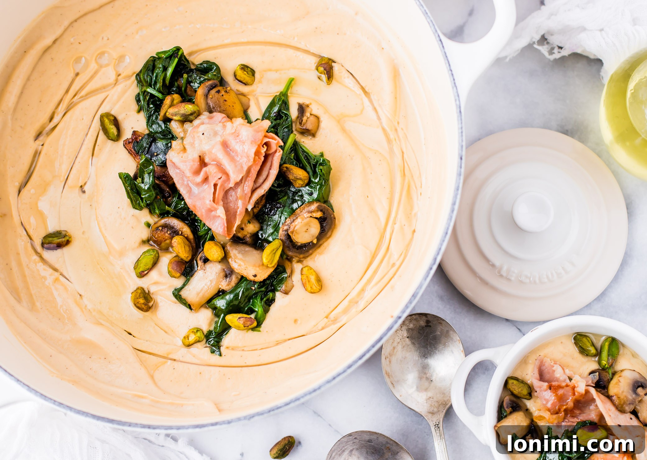 25 Hearty Whole30 Soups, Stews, and Chilis 22 Silky Roasted Garlic Cauliflower Soup with crispy prosciutto, a gourmet Whole30 option, beautifully plated.