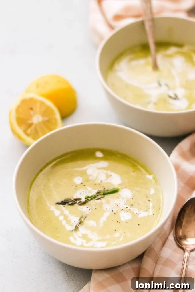 25 Hearty Whole30 Soups, Stews, and Chilis 23 Fresh and vibrant Creamy Whole30 Asparagus Soup, a simple yet elegant dish, bright green color.