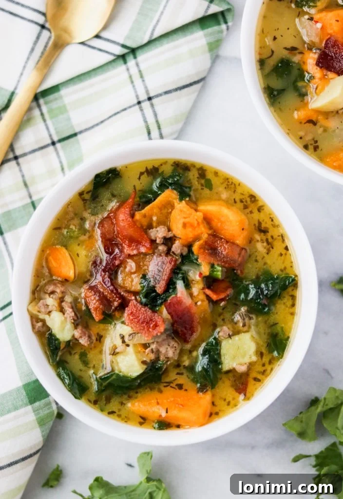 25 Hearty Whole30 Soups, Stews, and Chilis 5 A hearty bowl of Whole30 Zuppa Toscana, featuring savory sausage, tender kale, and a creamy, dairy-free broth.