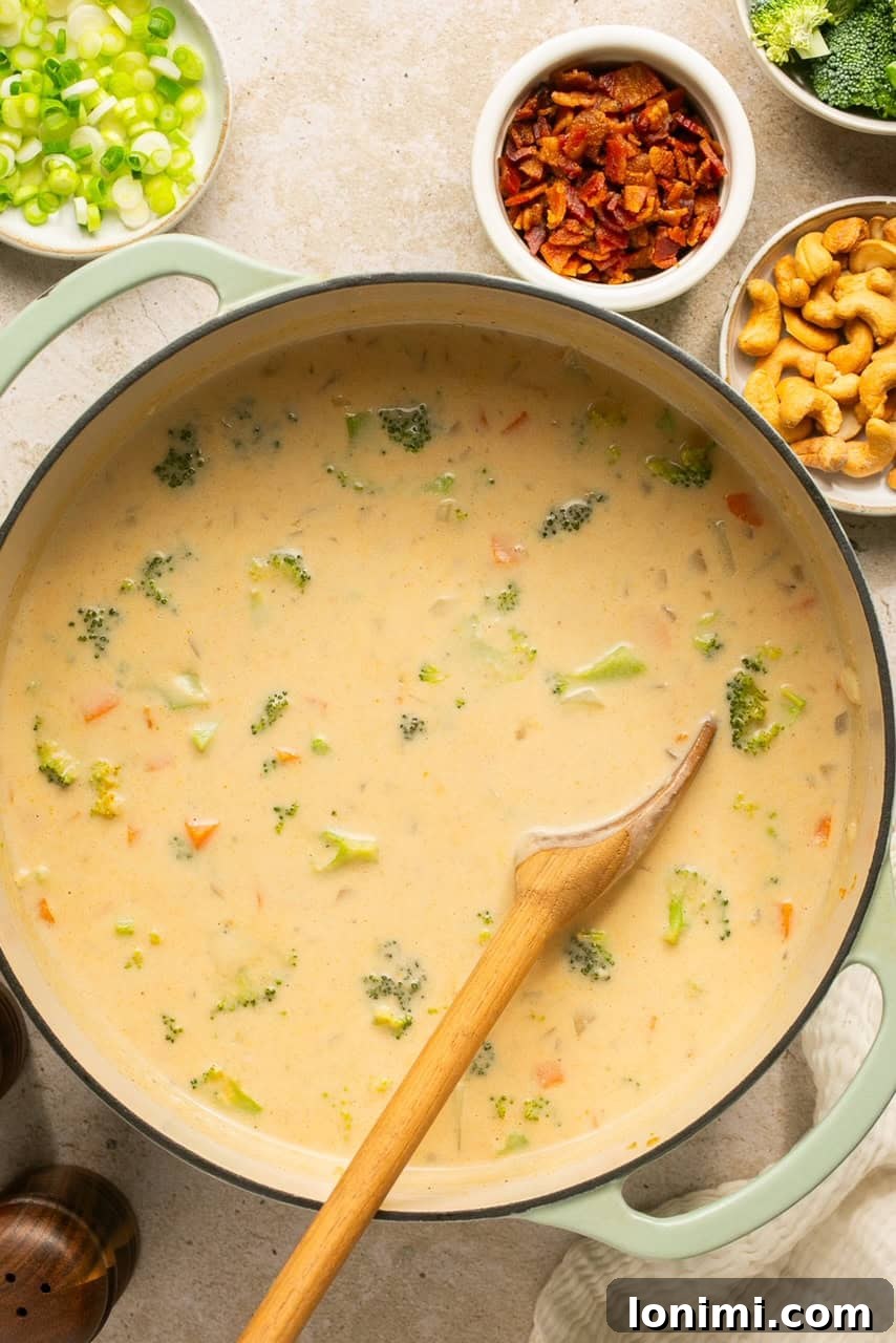 overhead shot of a pot filled with delicious dairy free loaded potato soup