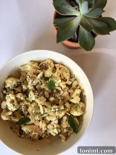 Roasted cauliflower florets coated in spices and ready for the oven
