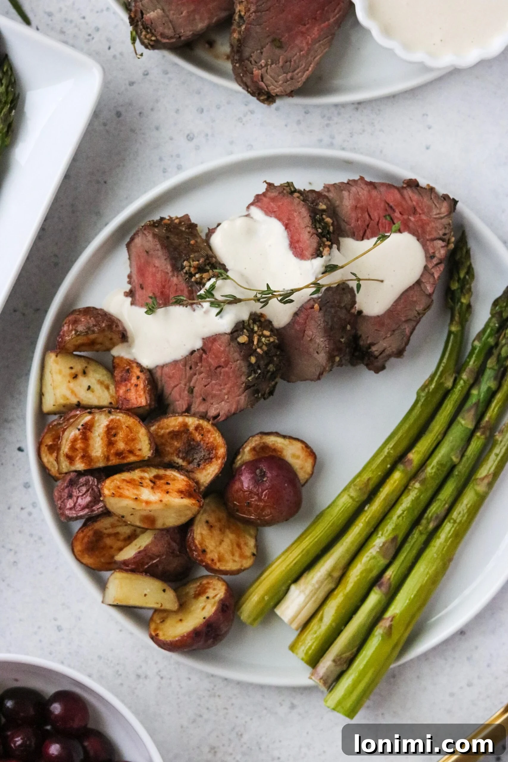 Pan-Seared Beef Tenderloin with Zesty Dairy-Free Horseradish Sauce 3 Close-up of seasoned raw beef tenderloin