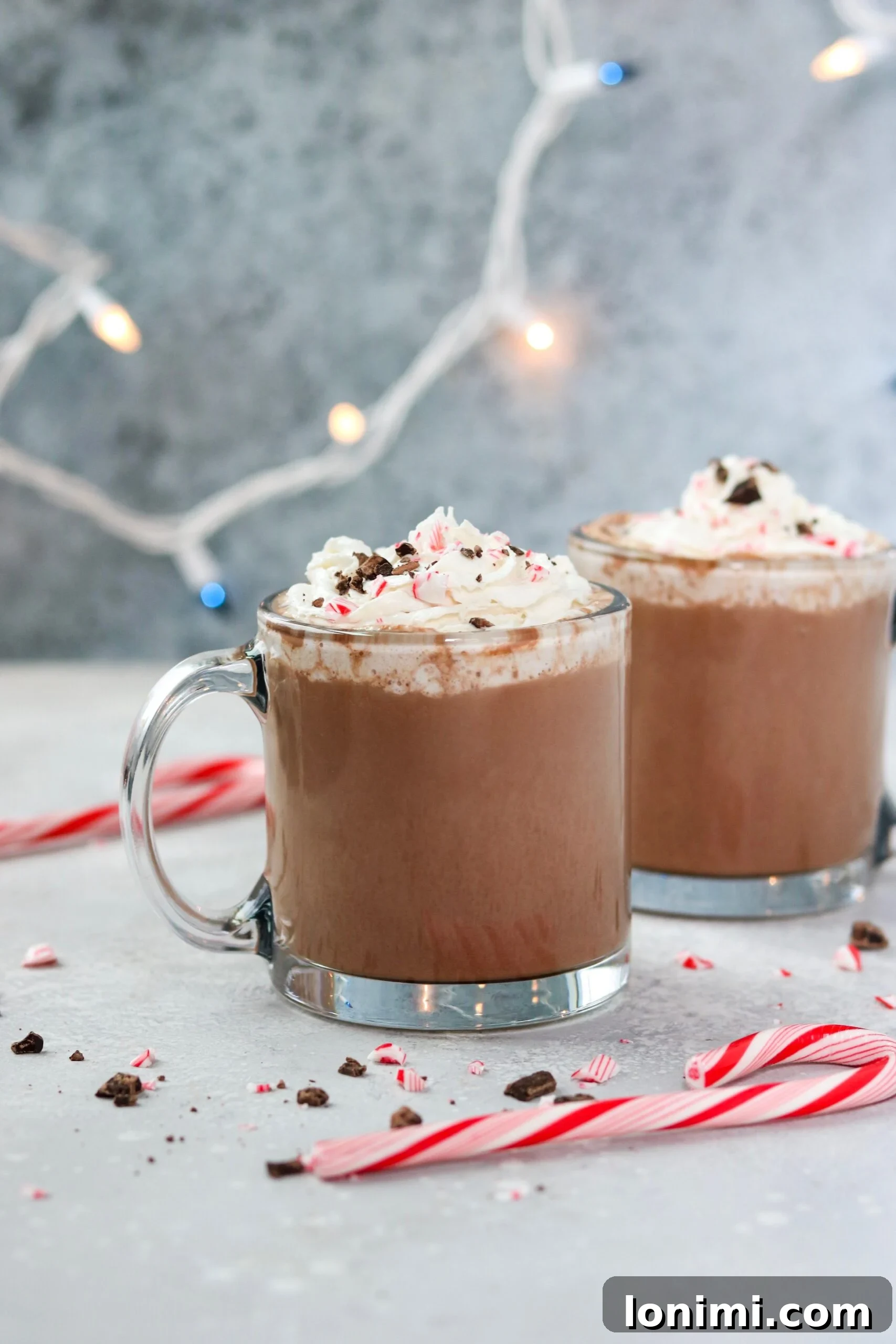 Hearthside Holiday Cocoa 5 A beautifully presented glass mug filled with hot chocolate, capturing the warm and inviting essence of a comforting winter beverage.