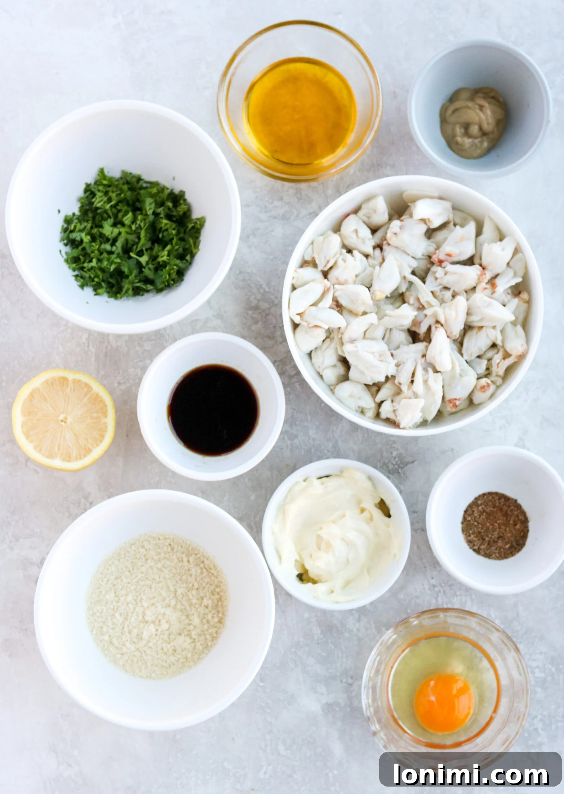 Ultimate Gluten Free Maryland Crab Cakes with Delicious Sauce Recipes 4 A flat lay of ingredients laid out to make healthy gluten-free crab cakes.
