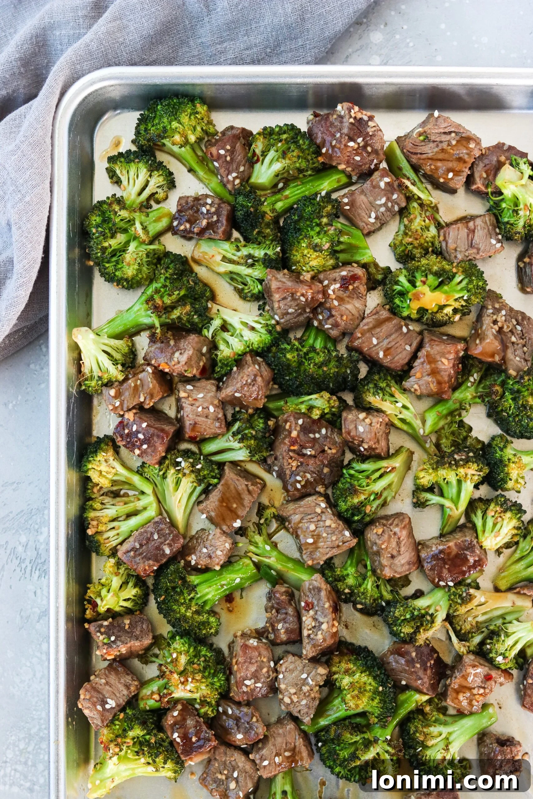 Delicious Sheet Pan Beef and Broccoli on a baking sheet, ready to be served.