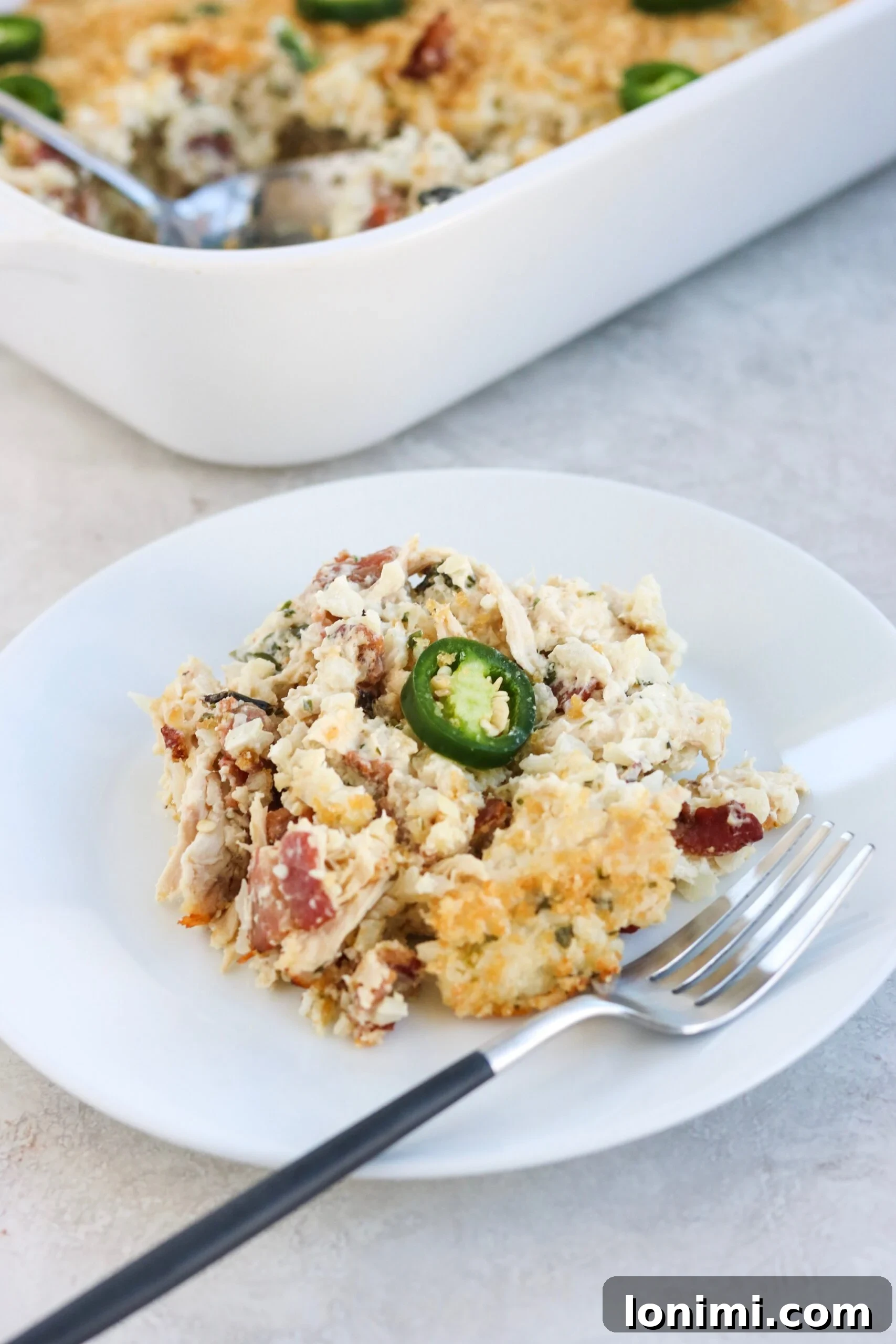 Close-up of the creamy, flavorful Bacon Jalapeno Popper Chicken Casserole mixture before baking.