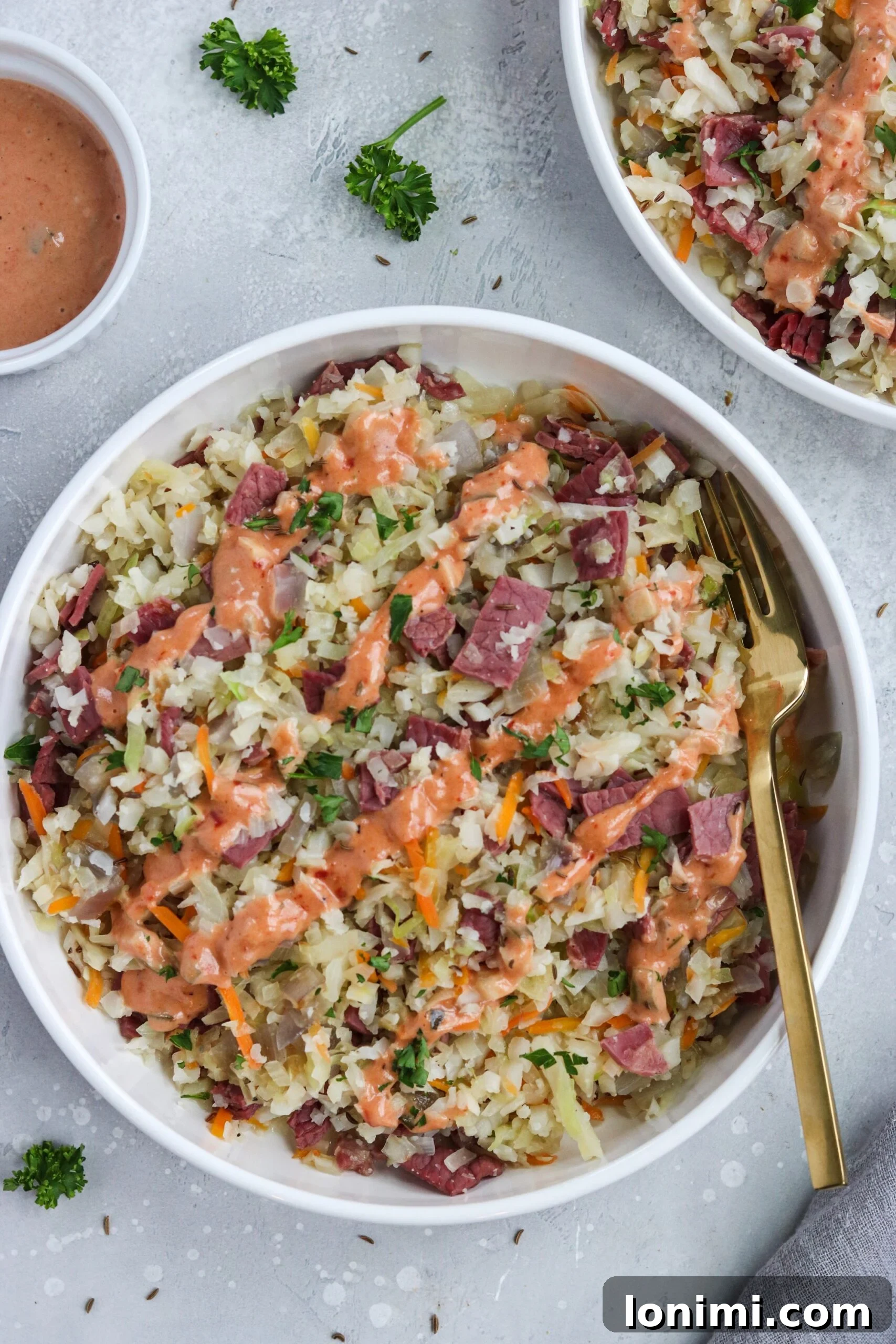 Keto Paleo Reuben Bowl 2 Delicious and healthy low-carb Reuben in a Bowl, featuring tender corned beef, sautéed cabbage, and homemade Thousand Island dressing.
