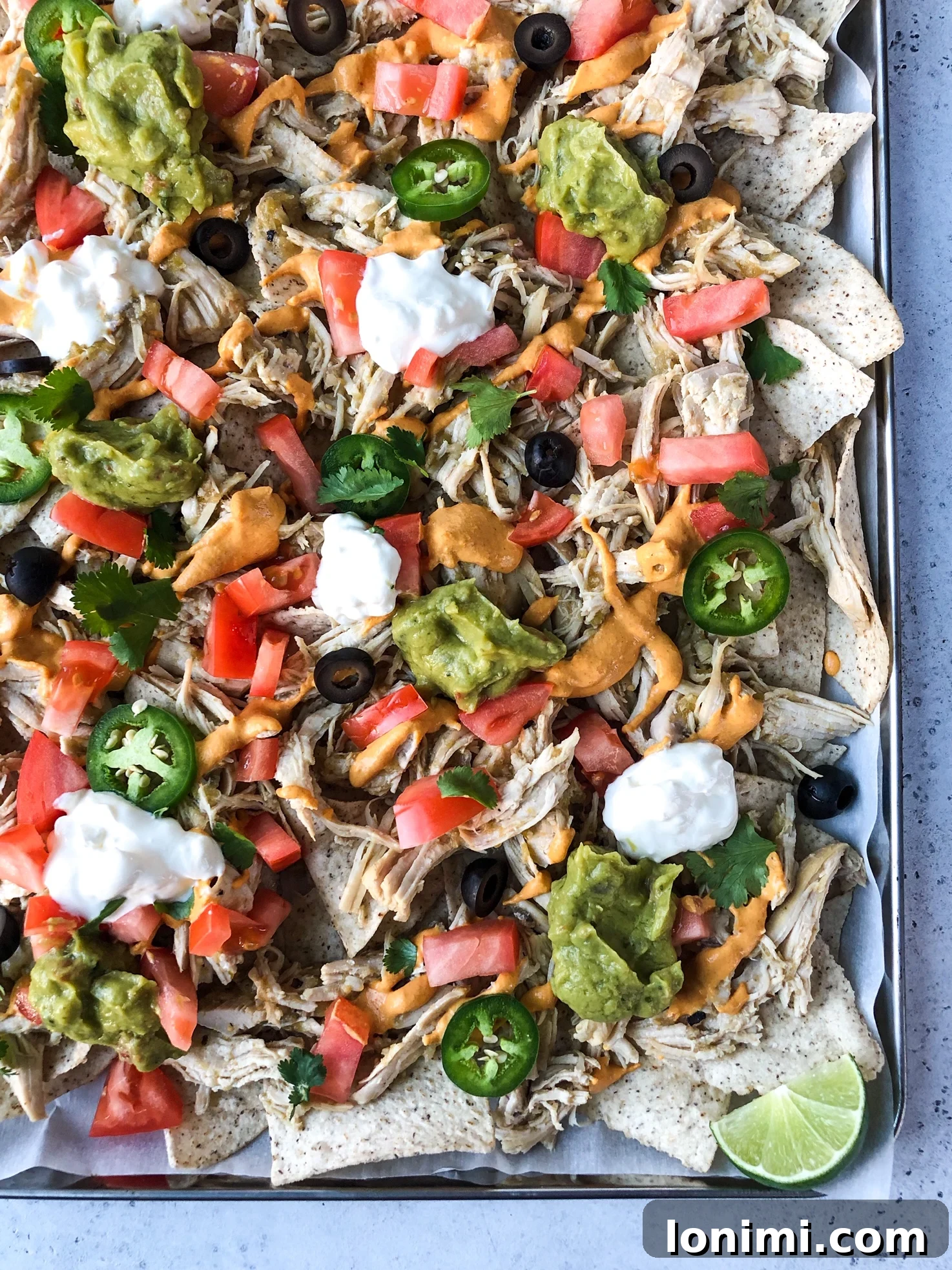 Shredded Chicken Nachos with various toppings