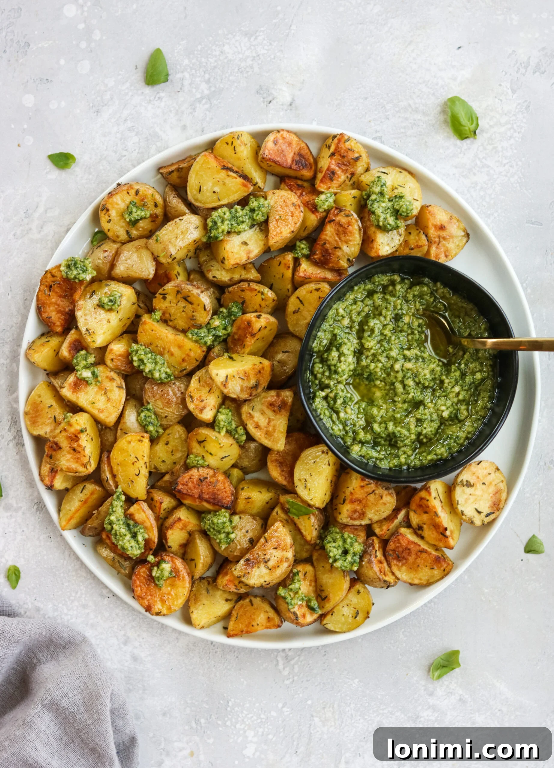 A vibrant bowl of homemade cashew pesto, showcasing its fresh green color