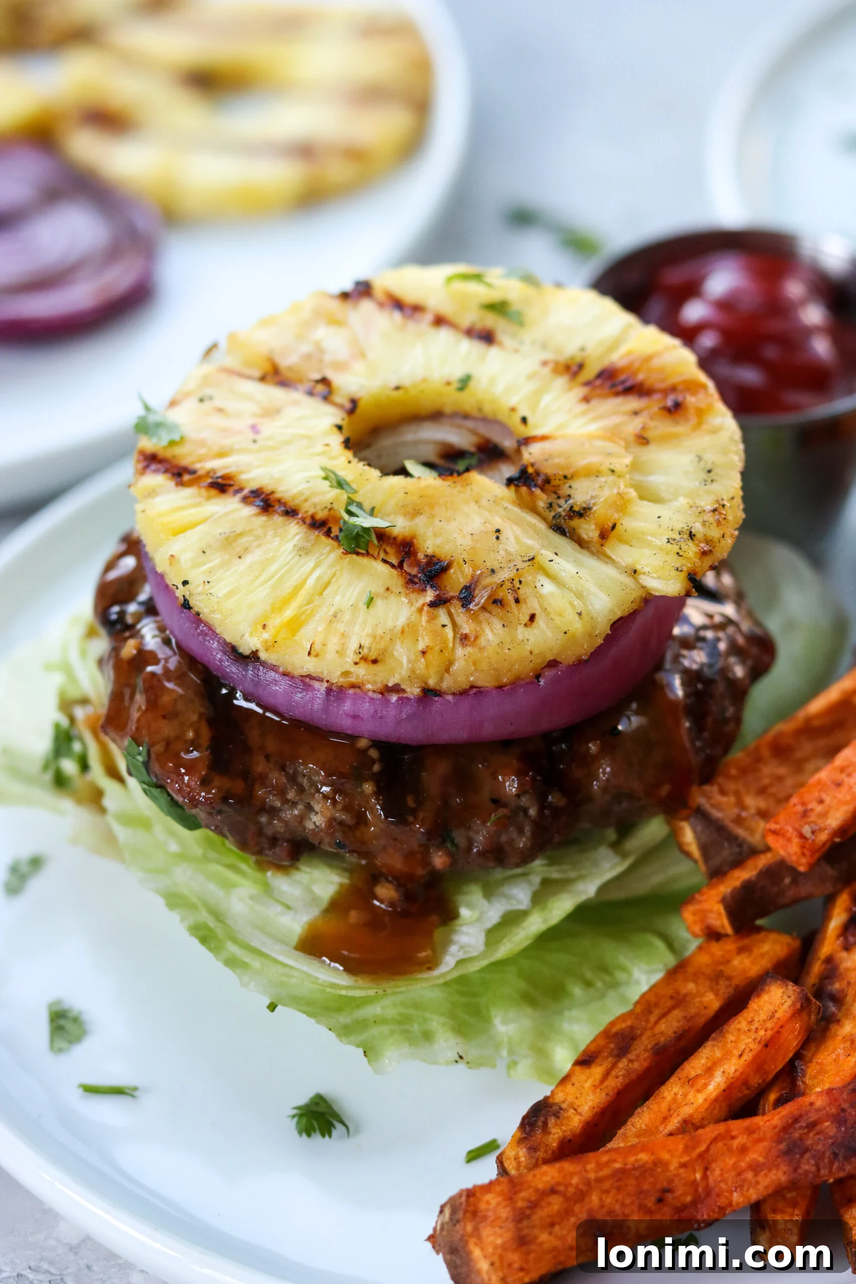 Tropical Teriyaki Whole30 Burgers with Grilled Pineapple 2 Flavorful Whole30 Teriyaki Burger with Sweet Grilled Pineapple and Red Onion on a Lettuce Bun