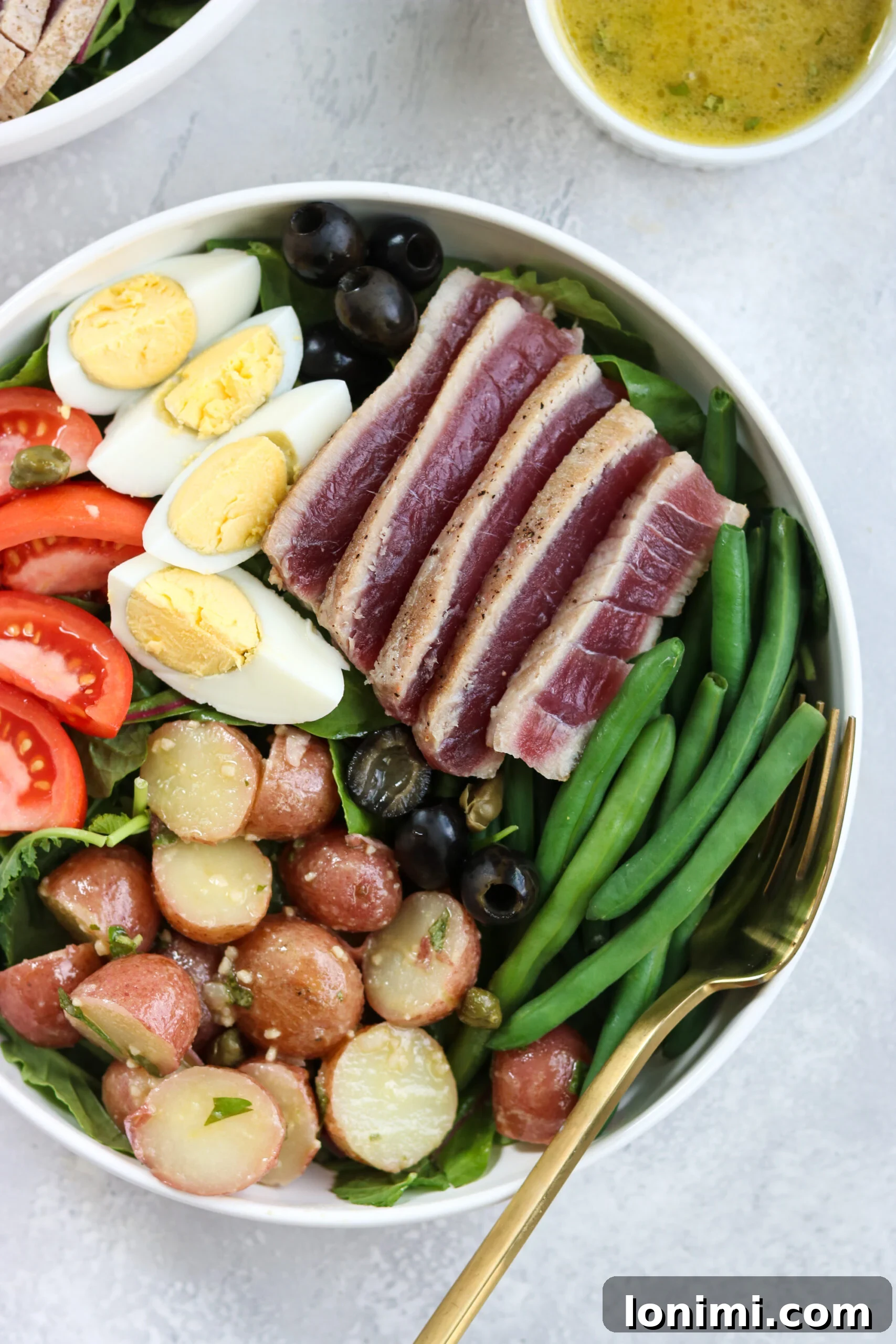Elegant Whole30 Nicoise Salad with Champagne Vinaigrette 2 Classic Whole30 Nicoise Salad with Seared Ahi Tuna and Fresh Greens
