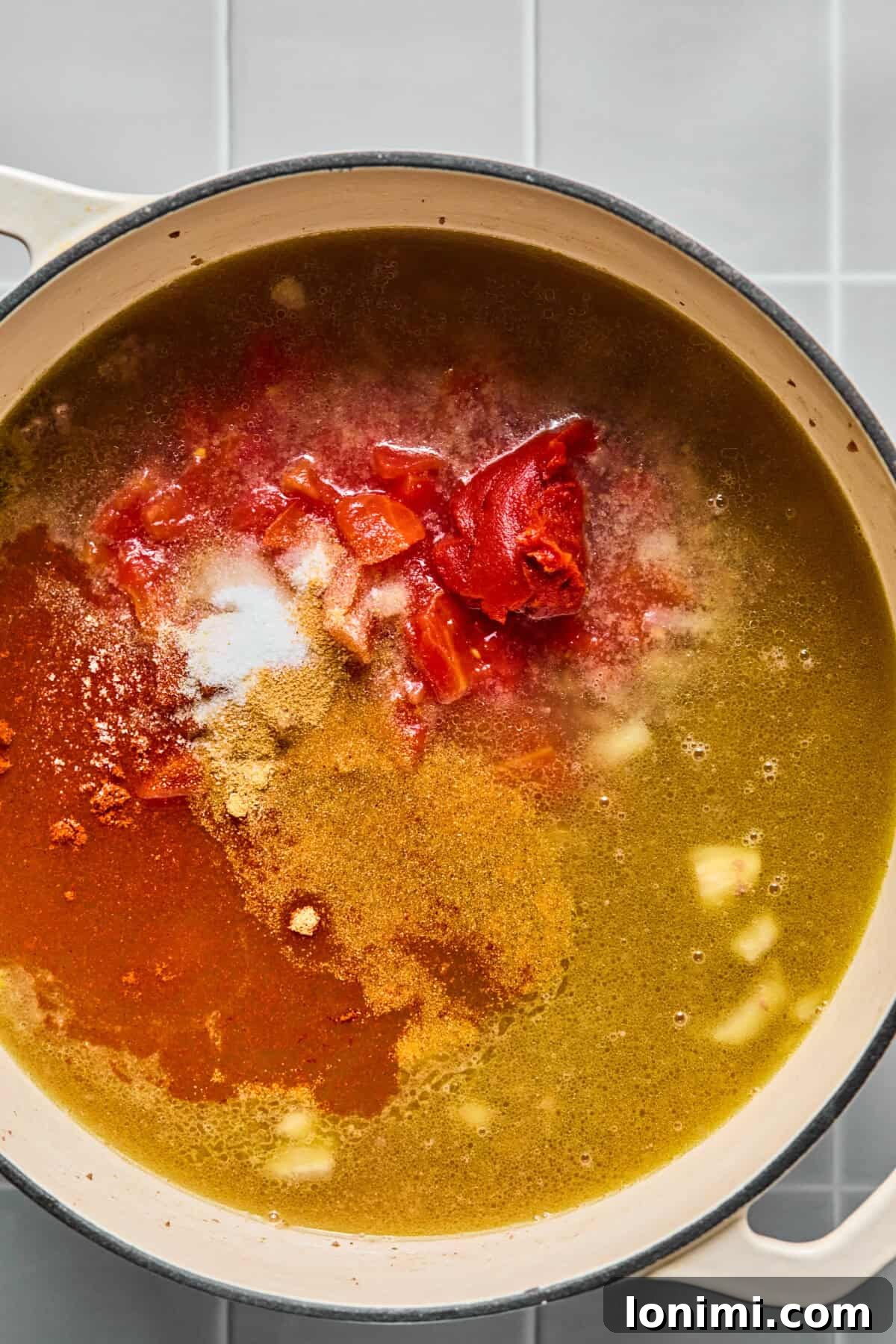 Hearty Gluten-Free Beef and Pasta Skillet Dairy-Free Option 5 Diced tomatoes, tomato paste, and broth added to the pot with the browned beef and aromatics, simmering together.
