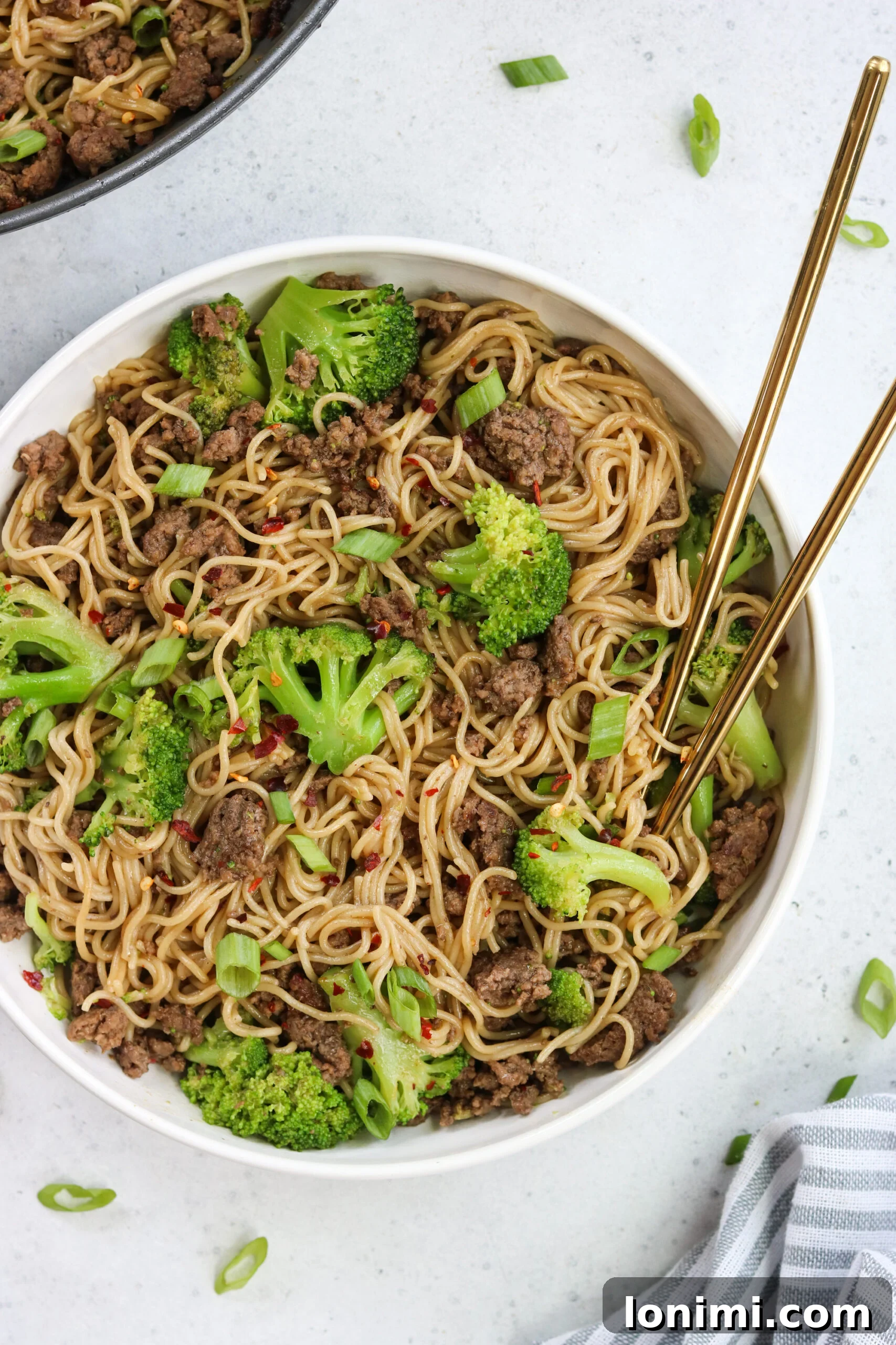 Savory Gluten Free Beef and Broccoli Ramen Stir Fry 4 Ingredients laid out for a healthy stir fry, including ground beef, broccoli, and various seasonings.