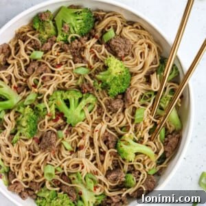 Savory Gluten Free Beef and Broccoli Ramen Stir Fry 6 A bowl of Beef and Broccoli Ramen Stir Fry, garnished with green onions.