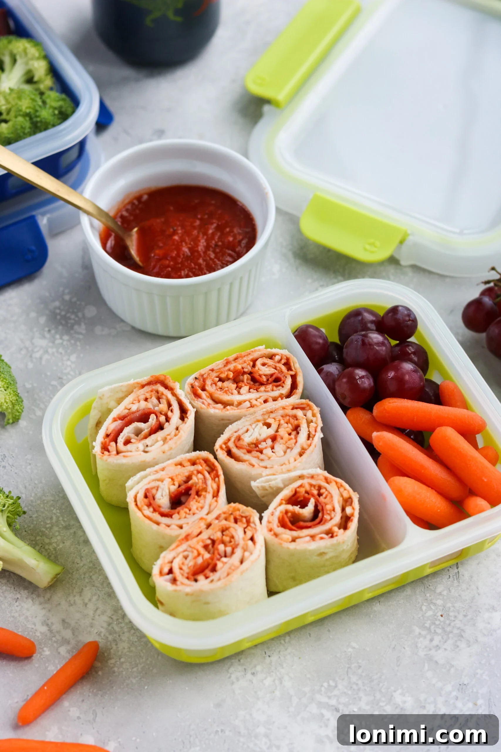 Overhead shot of Pizza Pinwheels being prepared on a cutting board