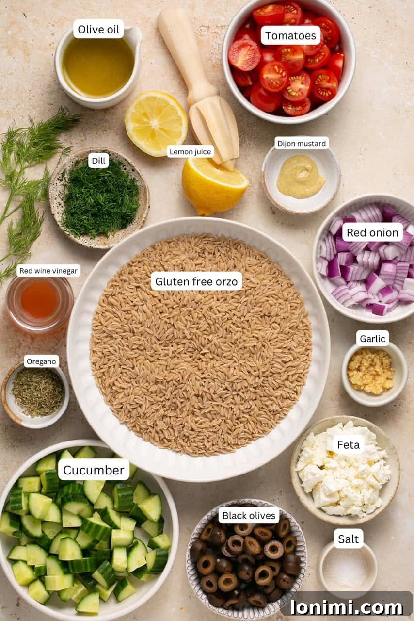 Individual bowls displaying the fresh ingredients for a Mediterranean orzo salad, including cucumber, cherry tomatoes, red onion, black olives, and feta cheese.
