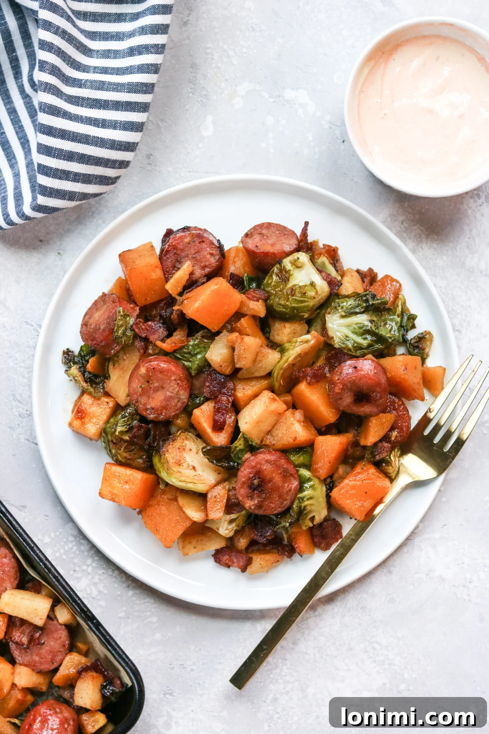 Ingredients for Whole30 Harvest Sheet Pan Dinner ready for roasting.