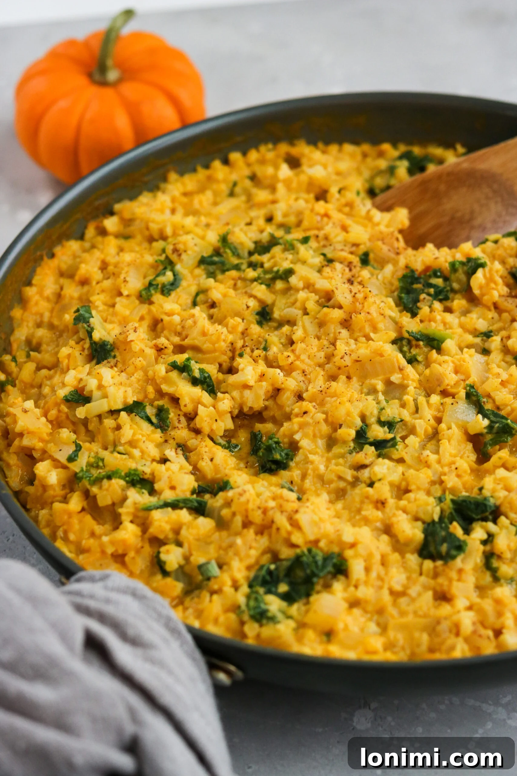 Whole30 Pumpkin Risotto with Shrimp in a bowl, garnished with fresh herbs, showcasing the creamy texture and succulent shrimp