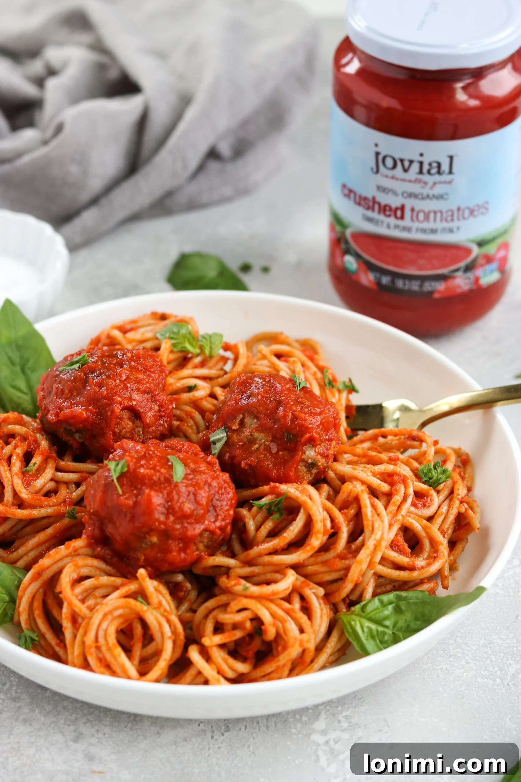 Homemade Marinara Sauce with Gluten-Free Meatballs simmering gently in a pot, ready to be served over pasta.