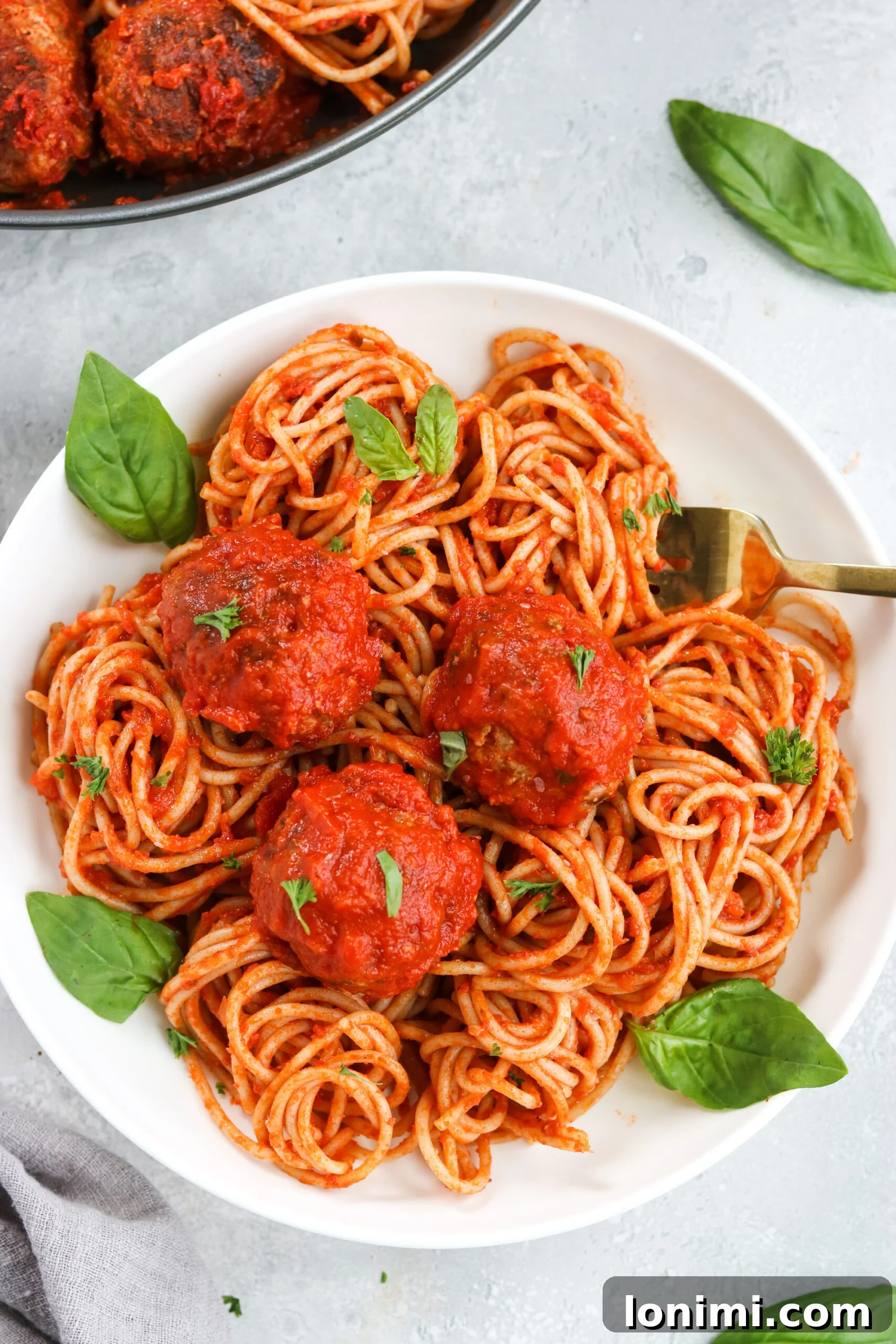 Close-up of baked Gluten-Free Italian Meatballs before being added to the marinara sauce.