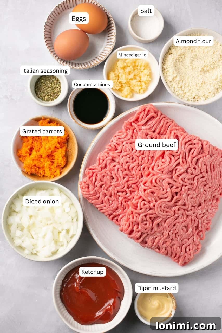 An organized display of fresh ingredients in nesting bowls, clearly labeled for making the healthy gluten-free meatloaf.