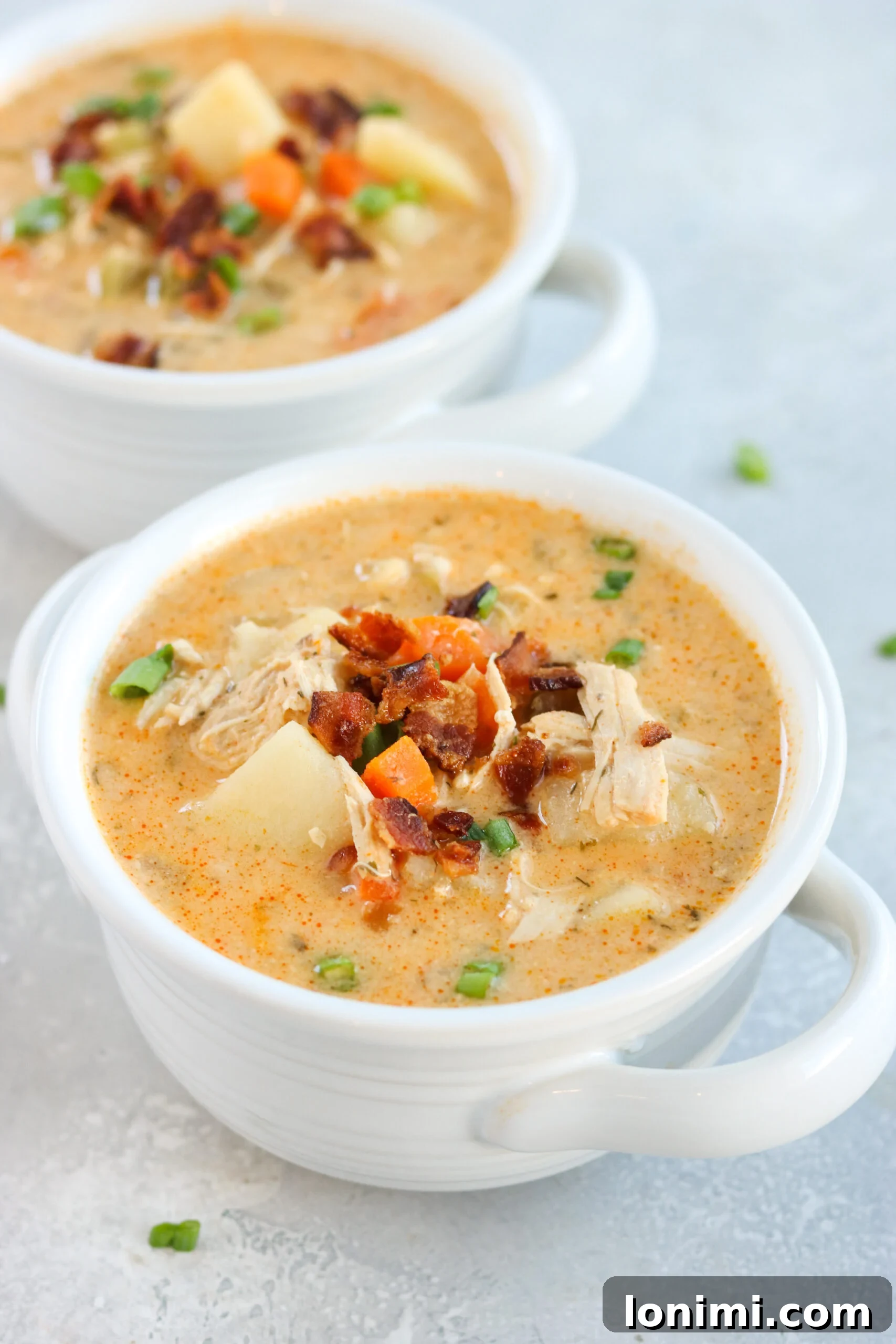 Spicy Buffalo Chicken Chowder 2 Hearty Whole30 Buffalo Ranch Chicken Chowder topped with bacon and green onions
