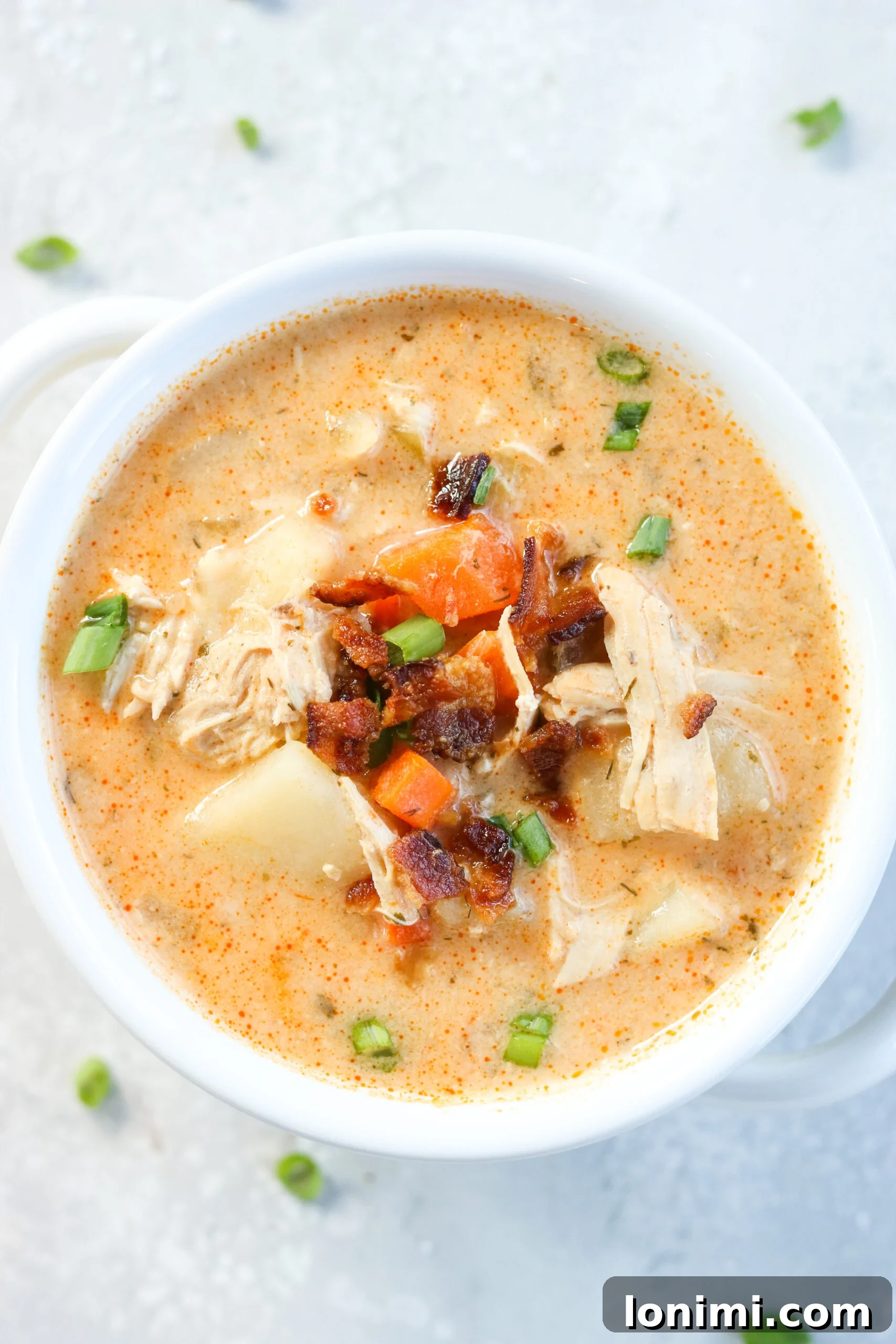 Spicy Buffalo Chicken Chowder 6 A serving of Whole30 Buffalo Ranch Chicken Chowder with a spoon