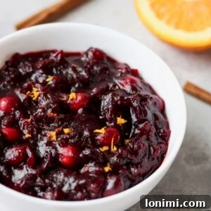 A vibrant bowl of Paleo Orange Cranberry Sauce, perfect for Thanksgiving.