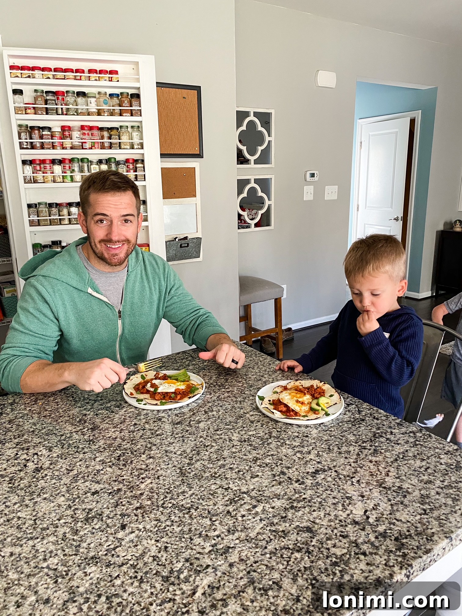 Family cooking and enjoying a delicious breakfast of Paleo Chorizo Huevos Rancheros