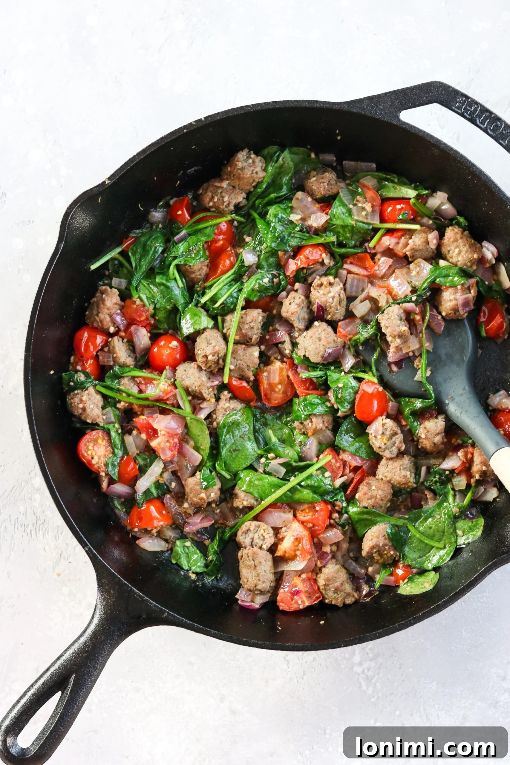 Vibrant Whole30 Mediterranean Frittata 6 Sauteed turkey sausage, tomato, and spinach